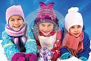 children playing on snow in winter time