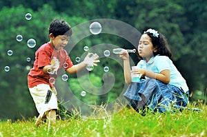 Children playing with soap bubbles