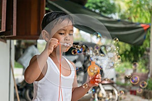 Children playing with soap bubbles, Boy with Bubbles