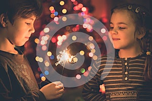 Children playing with sparklers