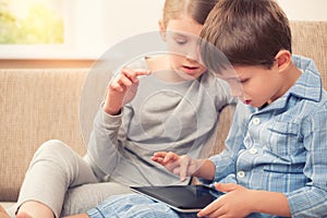 Children playing with tablet pc