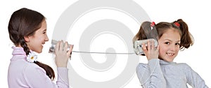 Children playing with tin can and string telephone