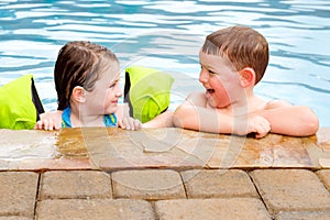 Children playing together in pool