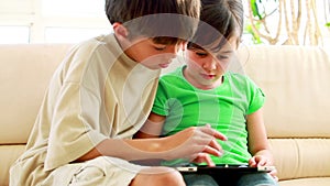 Children playing together with a tablet computer