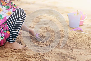 Children playing a toys on sand