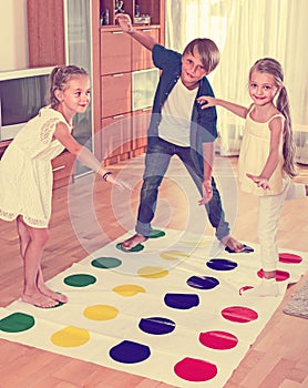Children playing twister at home