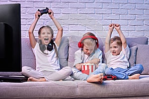 children playing video game with game console