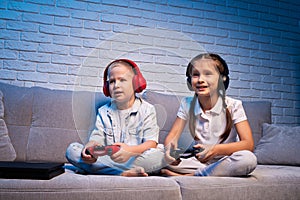 children playing video game with game console