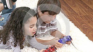 Children playing video games in the livingroom