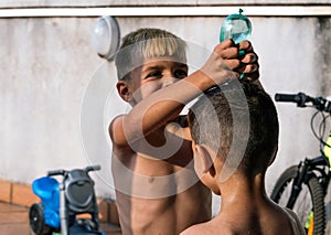 Children playing with water on a beautiful summer day