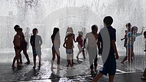 Children Playing in the Water Fountain