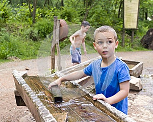 Children playing with water in park