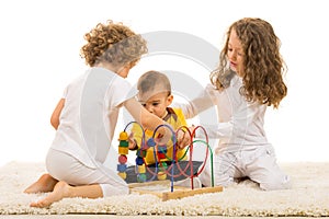 Children playing with wooden toy home