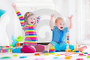 Children playing with wooden toys
