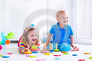 Children playing with wooden toys