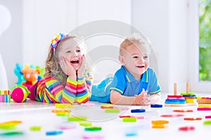 Children playing with wooden toys