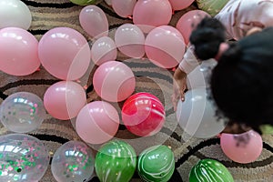 children playingand having fun with ballons at home