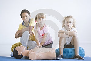 Children practicing chest compressions