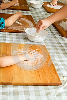 Children prepare cookies.