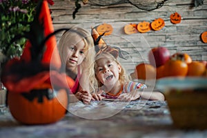 Children prepare pumpkin lantern before feast of all saints