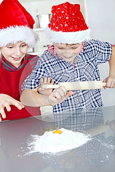 Children preparing christmas cake