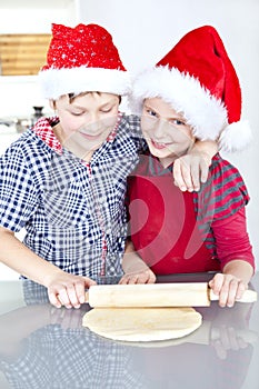 Children preparing christmas cake