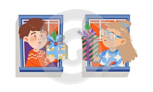 Children with present boxes looking out of windows. Lovely little boy and girl giving or receiving gifts through window