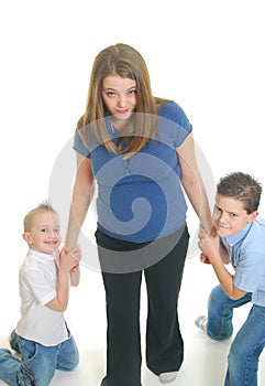 Children pulling on mother