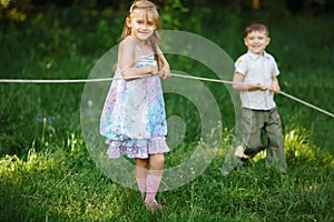 Children pulling the rope outdoors