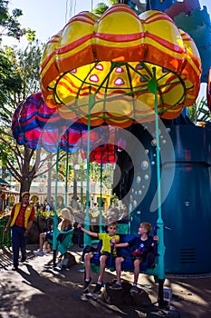 Children ready to ride amusement park Jumpin` Jellyfish