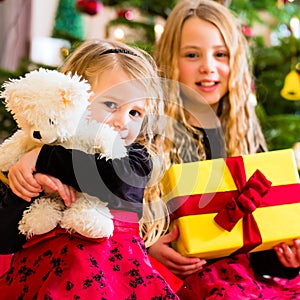 Children receiving presents on Christmas