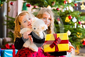 Children receiving presents on Christmas