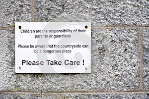 Children responsibility of parents the countryside is dangerous place please take care sign