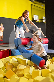 Children rest after intdoor activities in amusement park