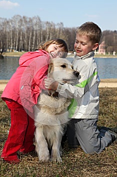 Children with retriever outdoor