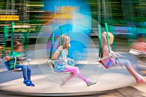 Children riding on a carousel