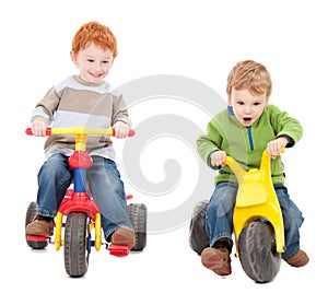 Children riding kids tricycles