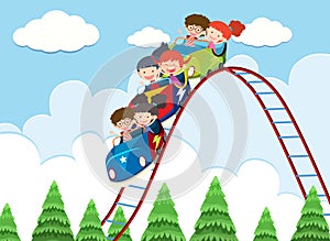 Children riding roller coaster