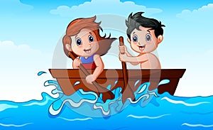 Children rowing a boat in the ocean