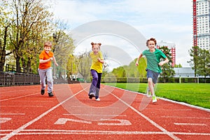 Children running the marathon on finish line