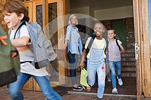 Children running outside school