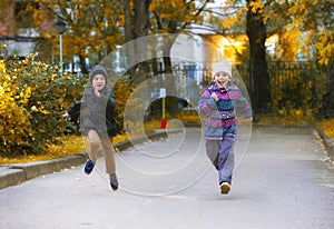 Children running a race on the asphalt path