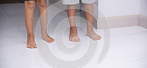 Children's bare feet. Child's bare feet on the white floor