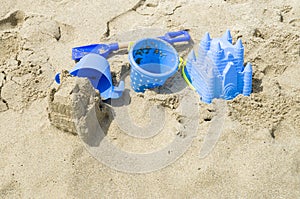 Children`s beach toys and sand castle