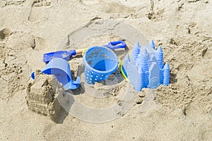 Children`s beach toys and sand castle