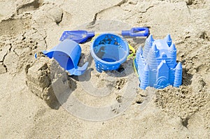 Children`s beach toys and sand castle