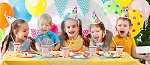 Children`s birthday. happy kids with cake