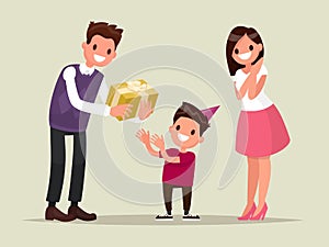 Children's birthday. Parents give her son a birthday present. Ve