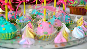 Children`s birthday party. Slow close-up motion of lollipops decorated with sweets