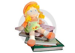 Children's books and a doll